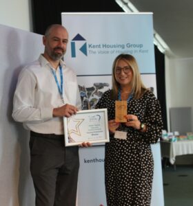Amber Tipping collects her Excellent Housing Professional Award from Chris Knowles
