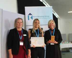 Ladies Night Project collect their Excellence in Delivering Services for Vulnerable People award from Vanessa Biddiss, Southern Housing
