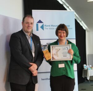 Lisa Clarke collects her Innovator of the Year award from David Smith SEC